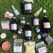 A photo showing different herbal remedies made at the Junior Herbalist Club. The home-made remedies include creams, ointments, syrups, soaps and cough drops.
