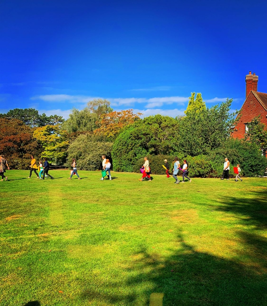 A photo of children walking across the lawn of Botanical Gardens at Leicester to collect Lavender at the Junior Herbalist Club