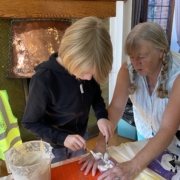 A photo of June and the kids making marshmallows at the junior herbalist club which are great for sore throats and coughs due to the demulcent anti-inflammatory action.